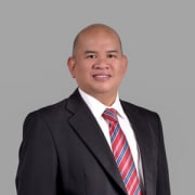 A professional headshot of Allan Miranda, dressed in a business suit with a tie, looking directly at the camera with a pleasant expression, suitable for corporate or professional profiles.