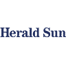 Dark blue background with 'Herald Sun' written in faint blue text, indicating the logo of a news publication."