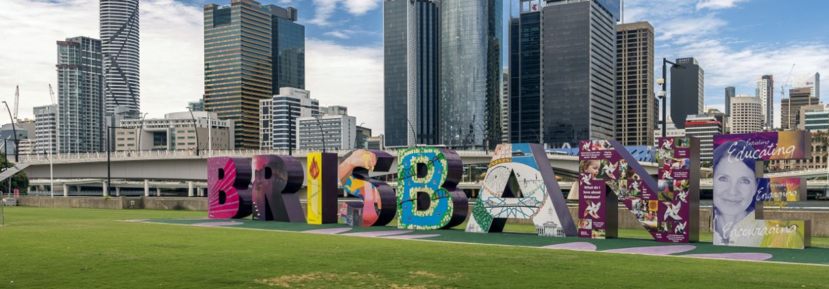 A piece of public art spelling the word Brisbane in front of that city's central business district in Queensland, Australia