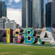 A piece of public art spelling the word Brisbane in front of that city's central business district in Queensland, Australia