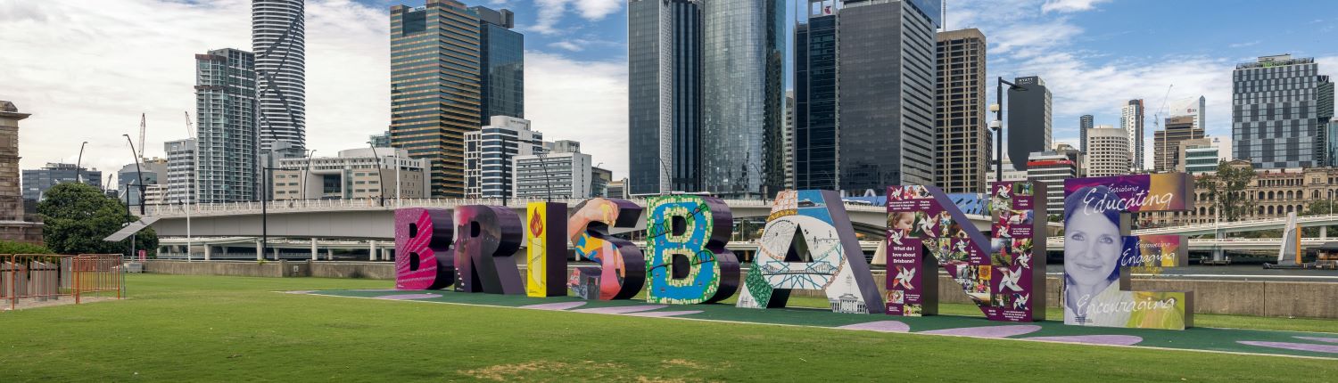 A piece of public art spelling the word Brisbane in front of that city's central business district in Queensland, Australia