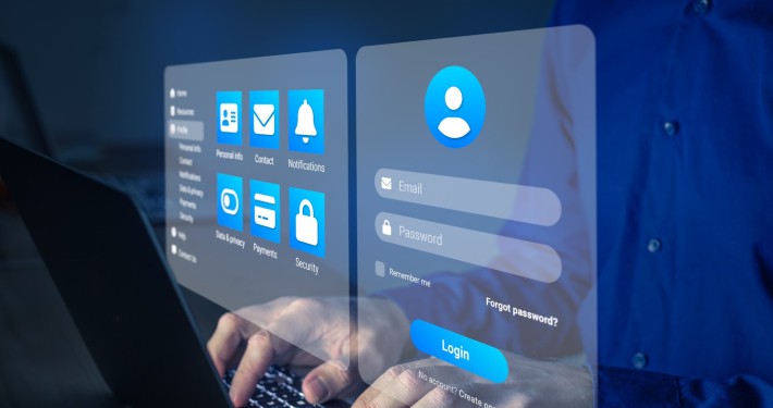 Person using a futuristic interface on a large touch screen, suggesting modern technology used in immigration services or client interactions