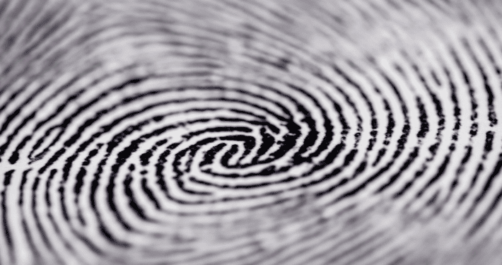 Close-up of a detailed water pattern creating concentric circles, resembling ripples in water or a fingerprint, signifying uniqueness or impact.