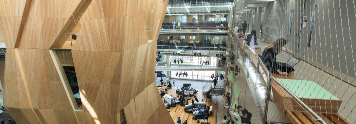 An interior shot of the modern, multi-level library at the Melbourne School of Design at the University of Melbourne